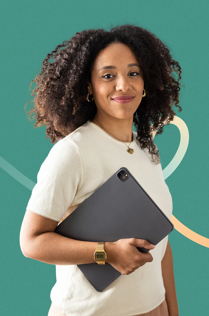 Smiling woman with curly hair holding a tablet against a teal background with abstract lines.