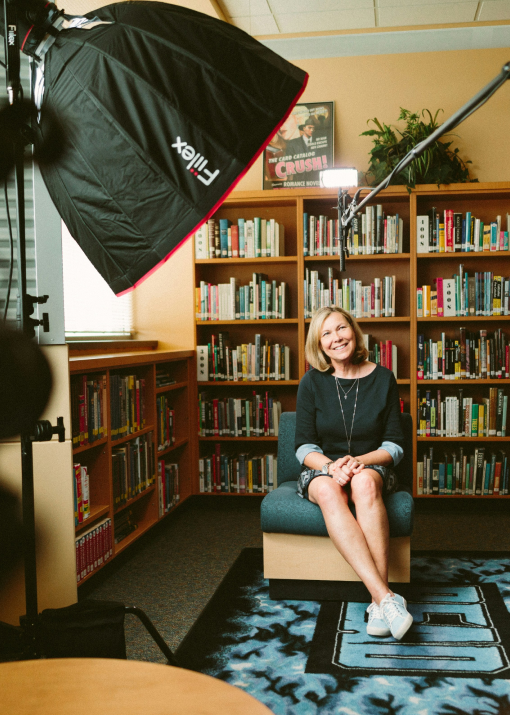 Picture of a set where a women is ready to be interviewed.