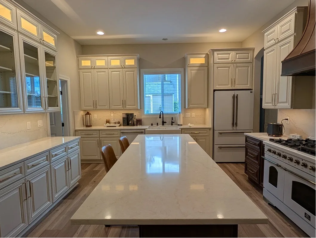Bonney Lake kitchen with a long island and lit glass-front cabinets