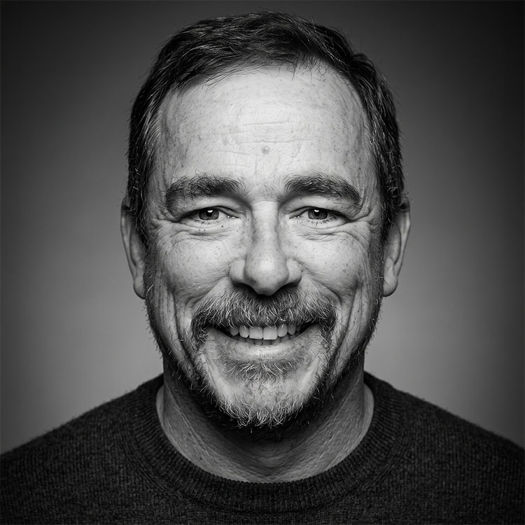 Dave Guthier headshot, black and white close up image of face