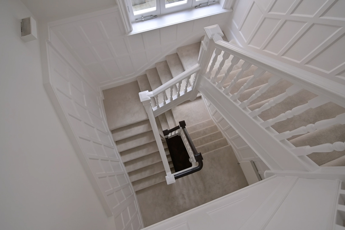 View of white staircase from above