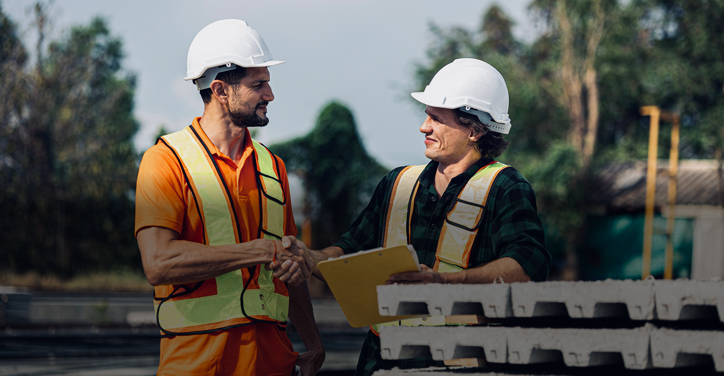Two person talking on construction site