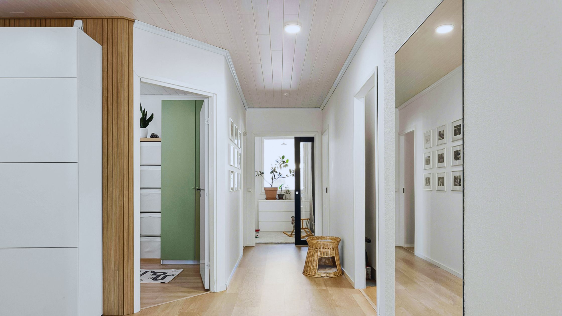 "A modern suburban home with a spacious driveway and double garage, set against a vibrant sunset sky, featuring well-maintained landscaping and a cozy porch light illuminating the entryway.