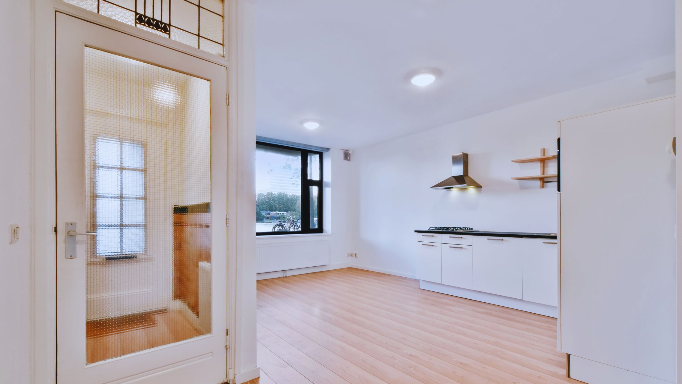 "A modern suburban home with a spacious driveway and double garage, set against a vibrant sunset sky, featuring well-maintained landscaping and a cozy porch light illuminating the entryway.