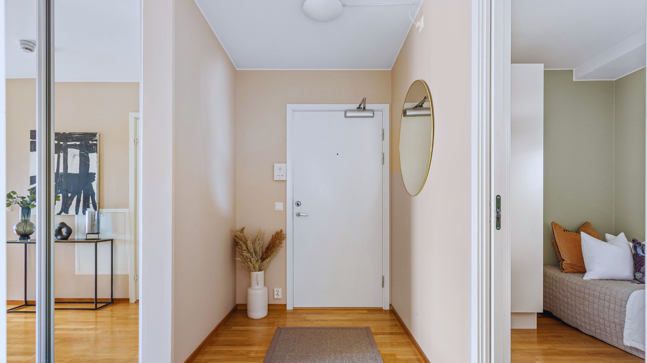"A modern suburban home with a spacious driveway and double garage, set against a vibrant sunset sky, featuring well-maintained landscaping and a cozy porch light illuminating the entryway.