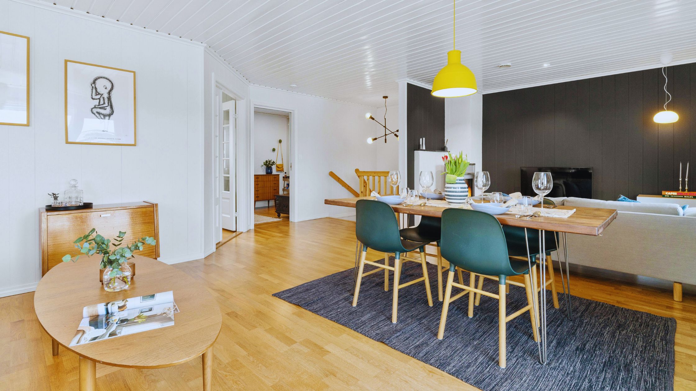 "A modern suburban home with a spacious driveway and double garage, set against a vibrant sunset sky, featuring well-maintained landscaping and a cozy porch light illuminating the entryway.