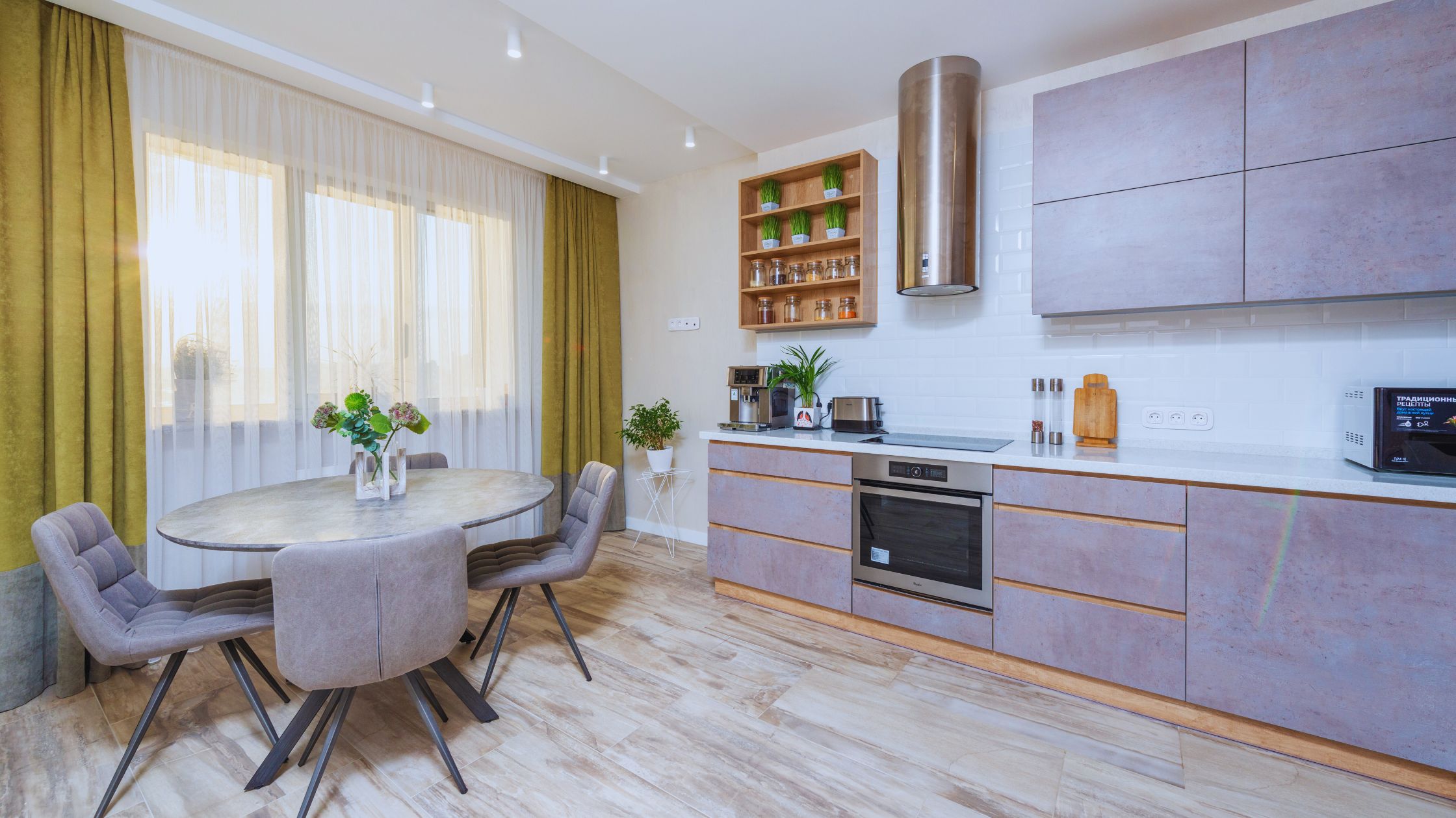 "A modern suburban home with a spacious driveway and double garage, set against a vibrant sunset sky, featuring well-maintained landscaping and a cozy porch light illuminating the entryway.