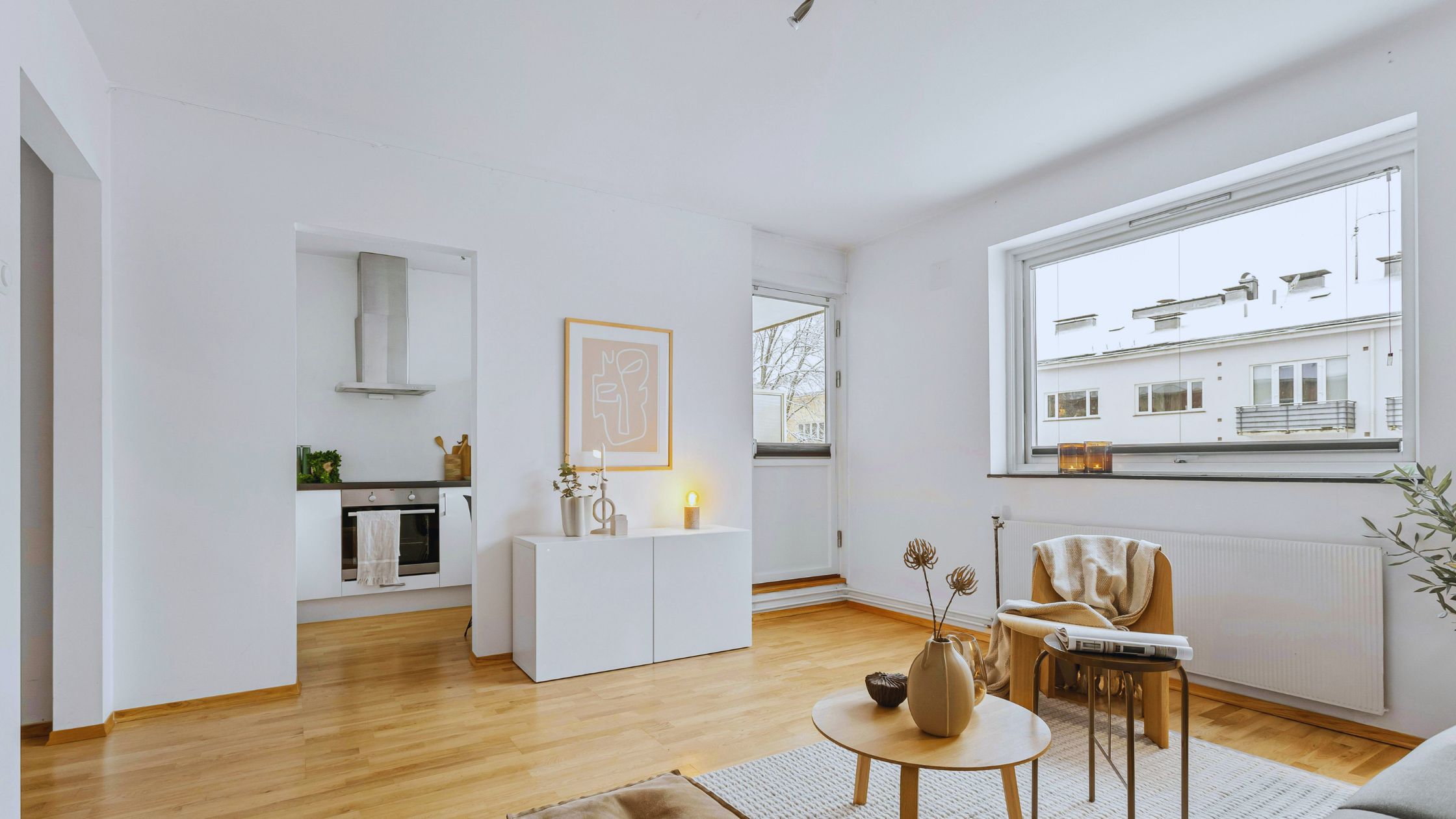 "A modern suburban home with a spacious driveway and double garage, set against a vibrant sunset sky, featuring well-maintained landscaping and a cozy porch light illuminating the entryway.