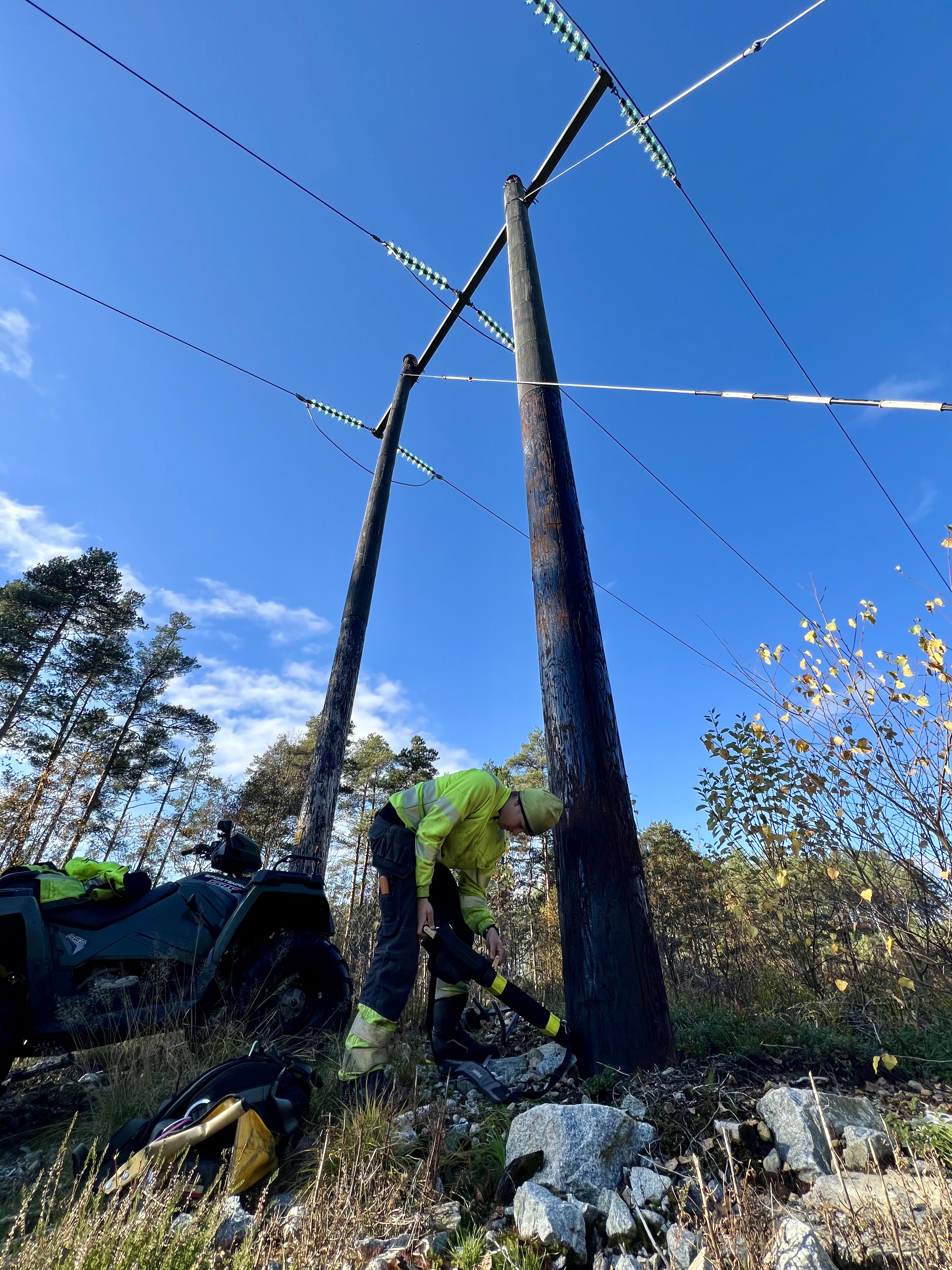 Line worker and a utility pole