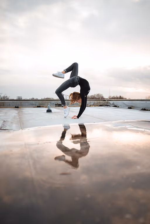 First Technology woman doing a flip