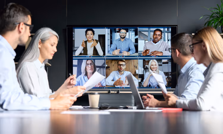 First Technology coworkers sitting around the table