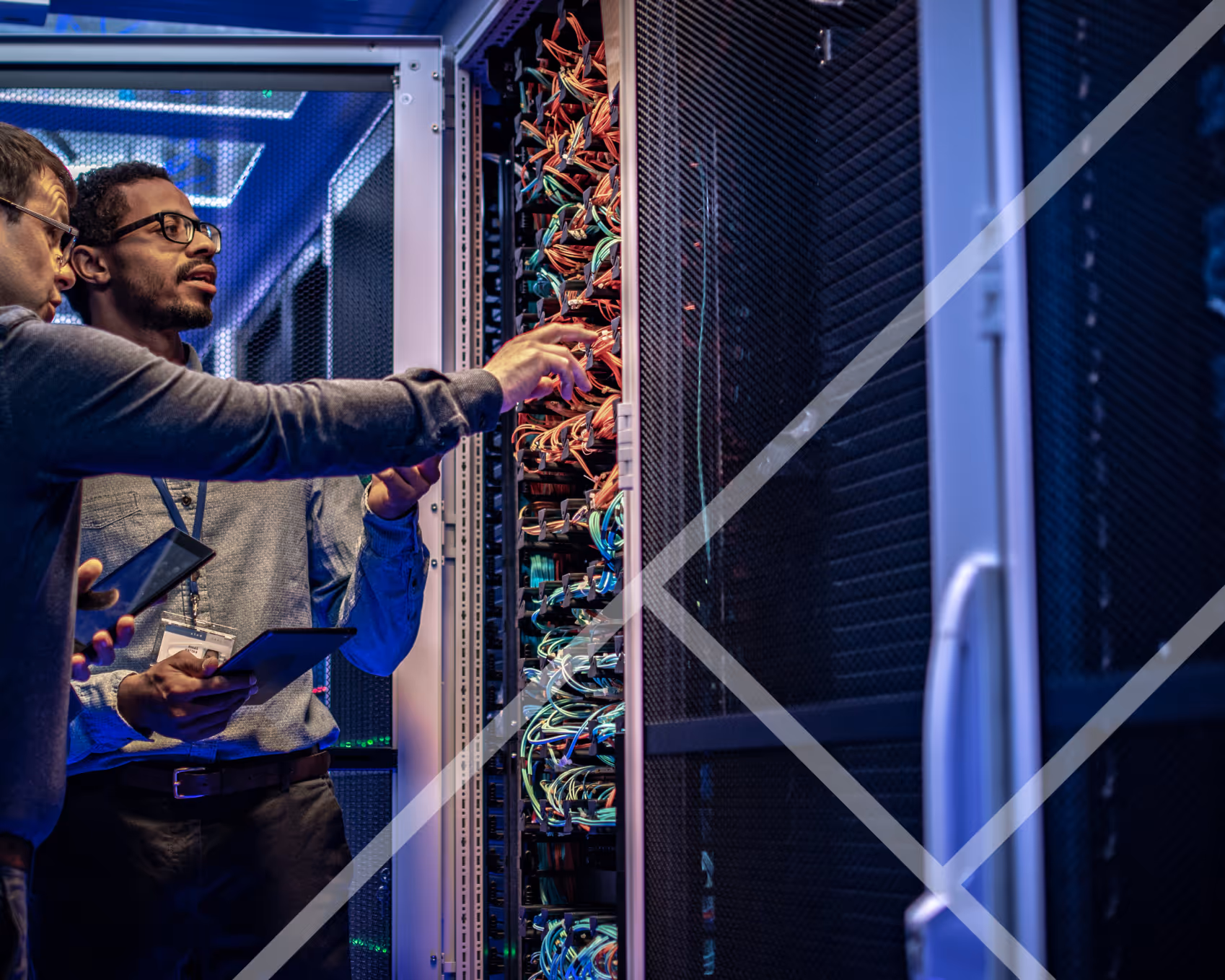 Two men standing next to servers - First Technology Datacentre and Cloud