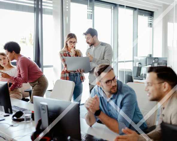 An office with men and women working together and talking