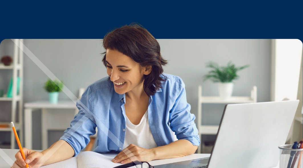 Woman sitting at a laptop First Technology Cyber Security Solutions Workshops