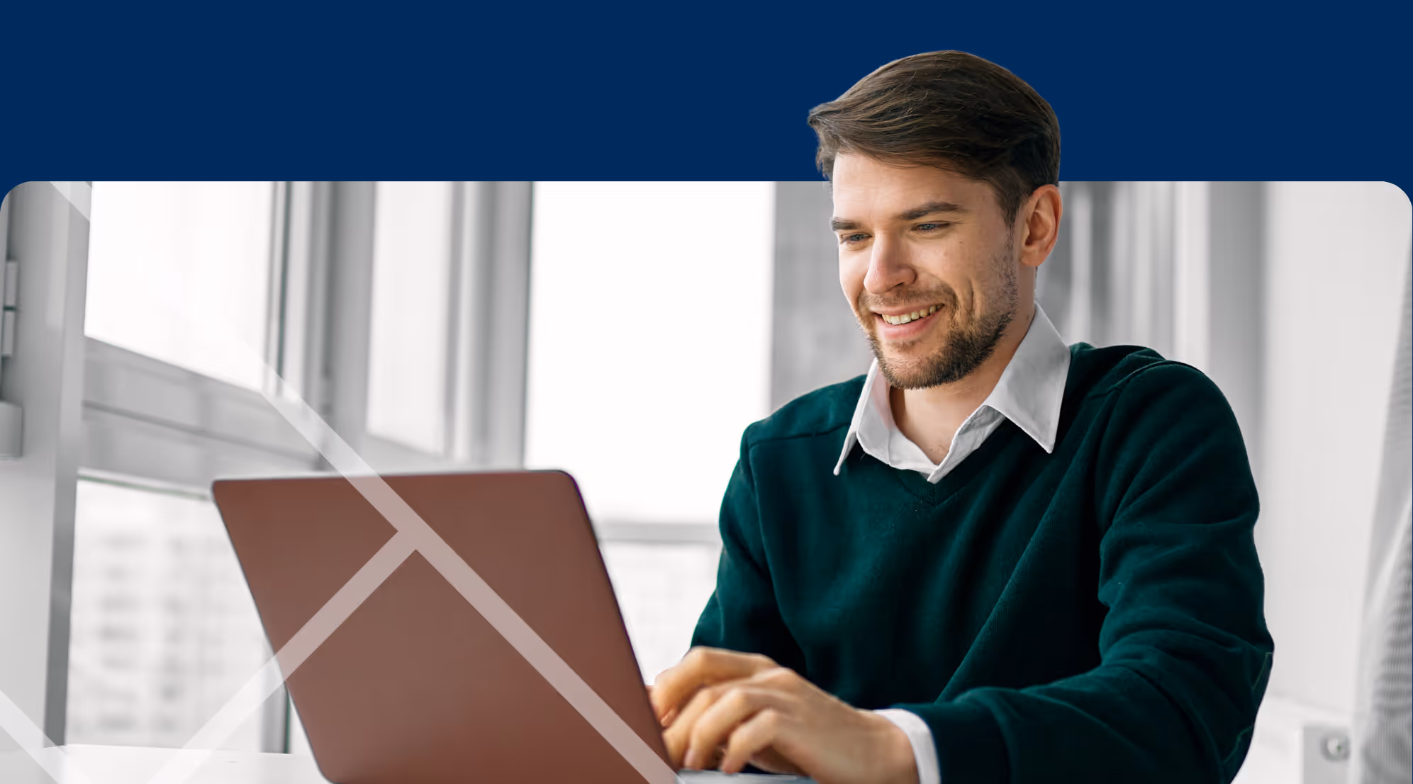 Man sitting at a laptop First Technology Cyber Security Solutions Workshops