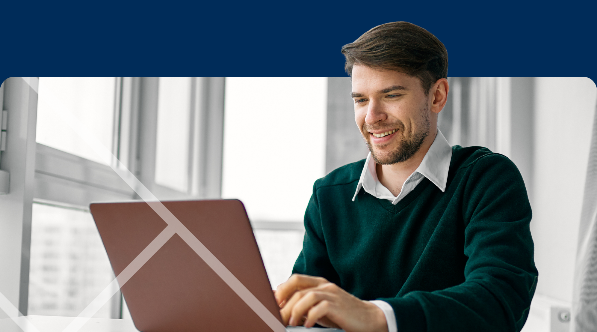 Man sitting at a laptop First Technology Cyber Security Solutions Workshops