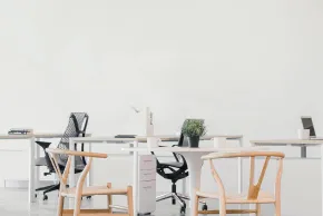 office with white walls and tables