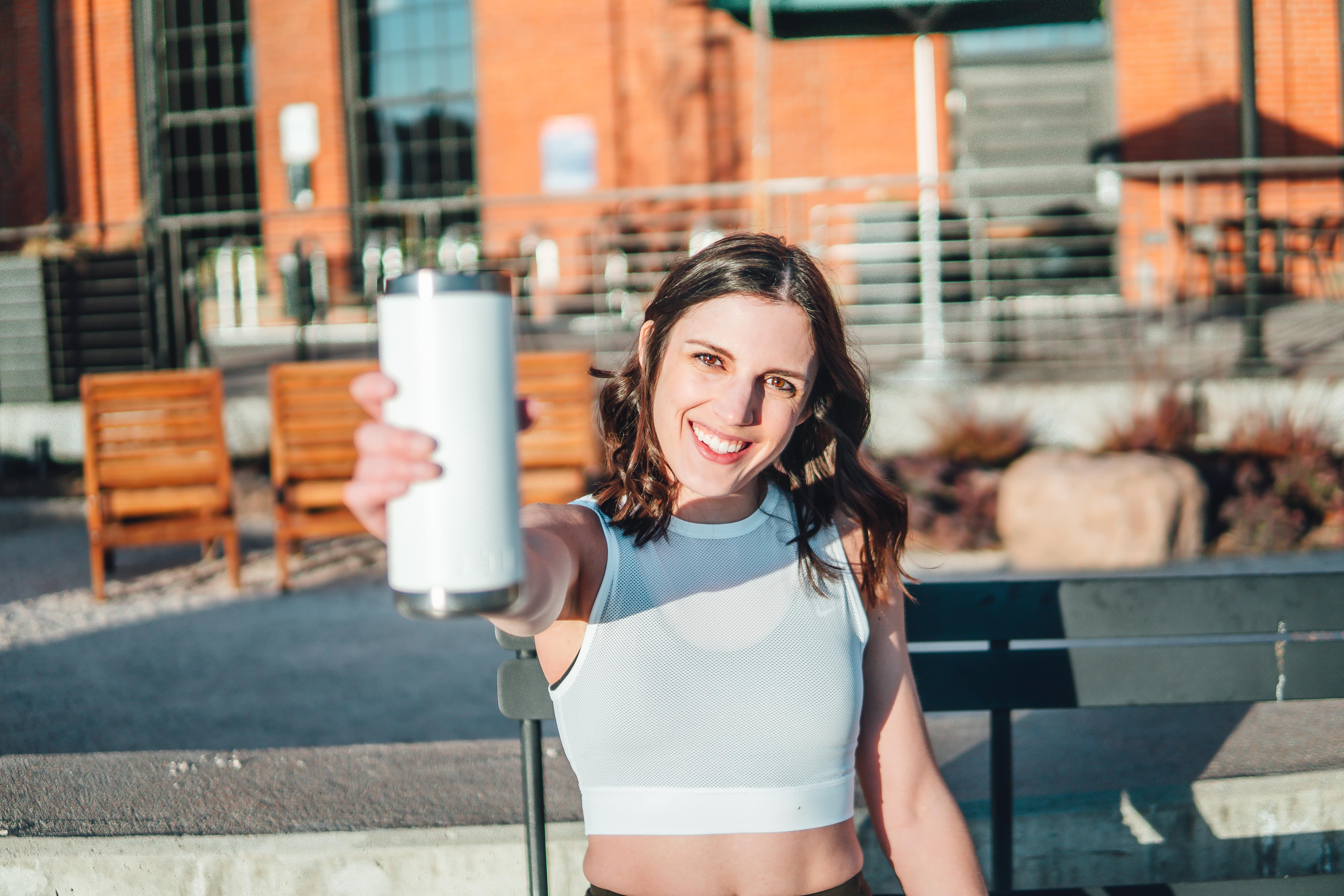 Trainer holding a water bottle