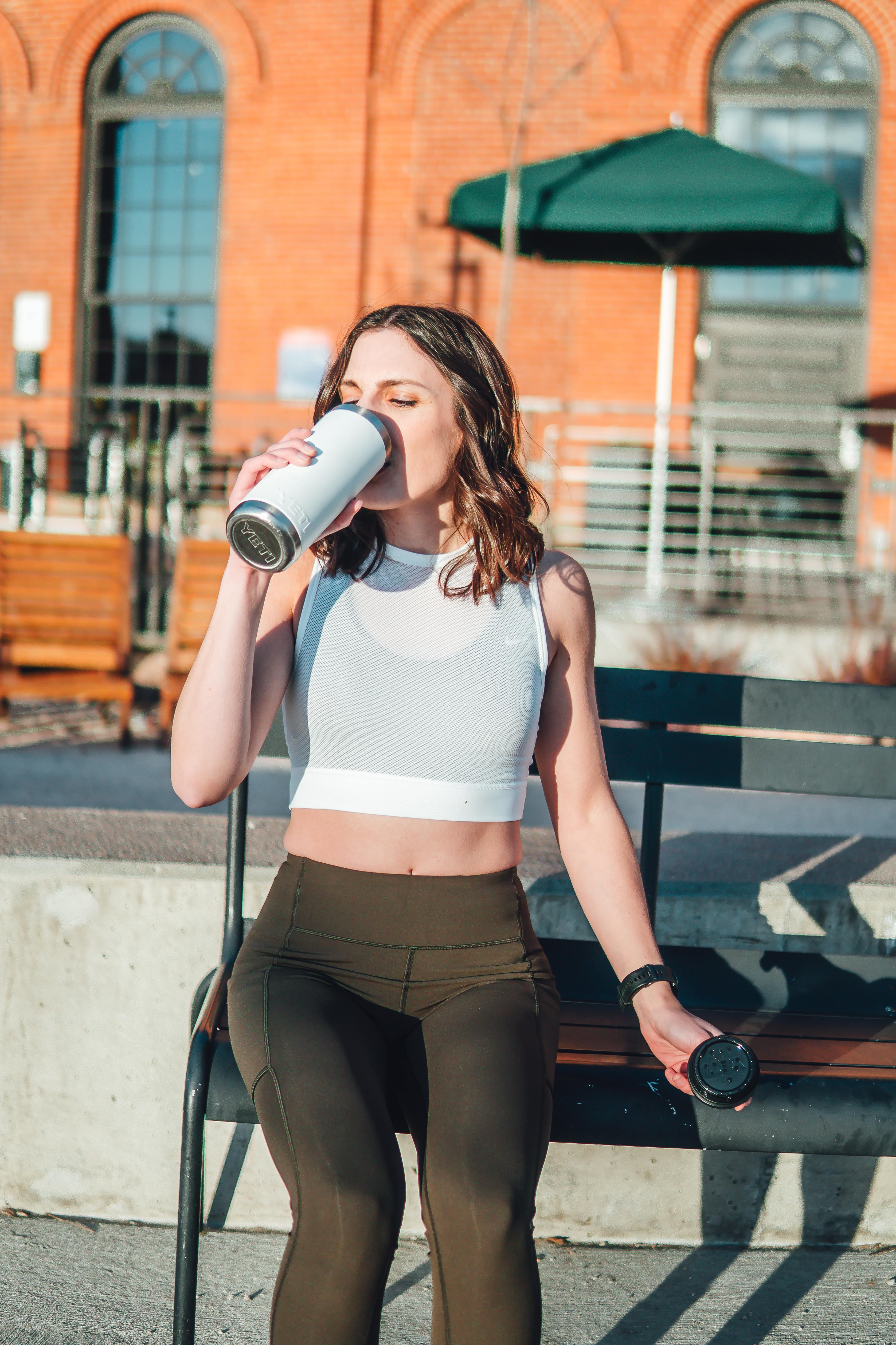 Drinking water to stay hydrated for recovery