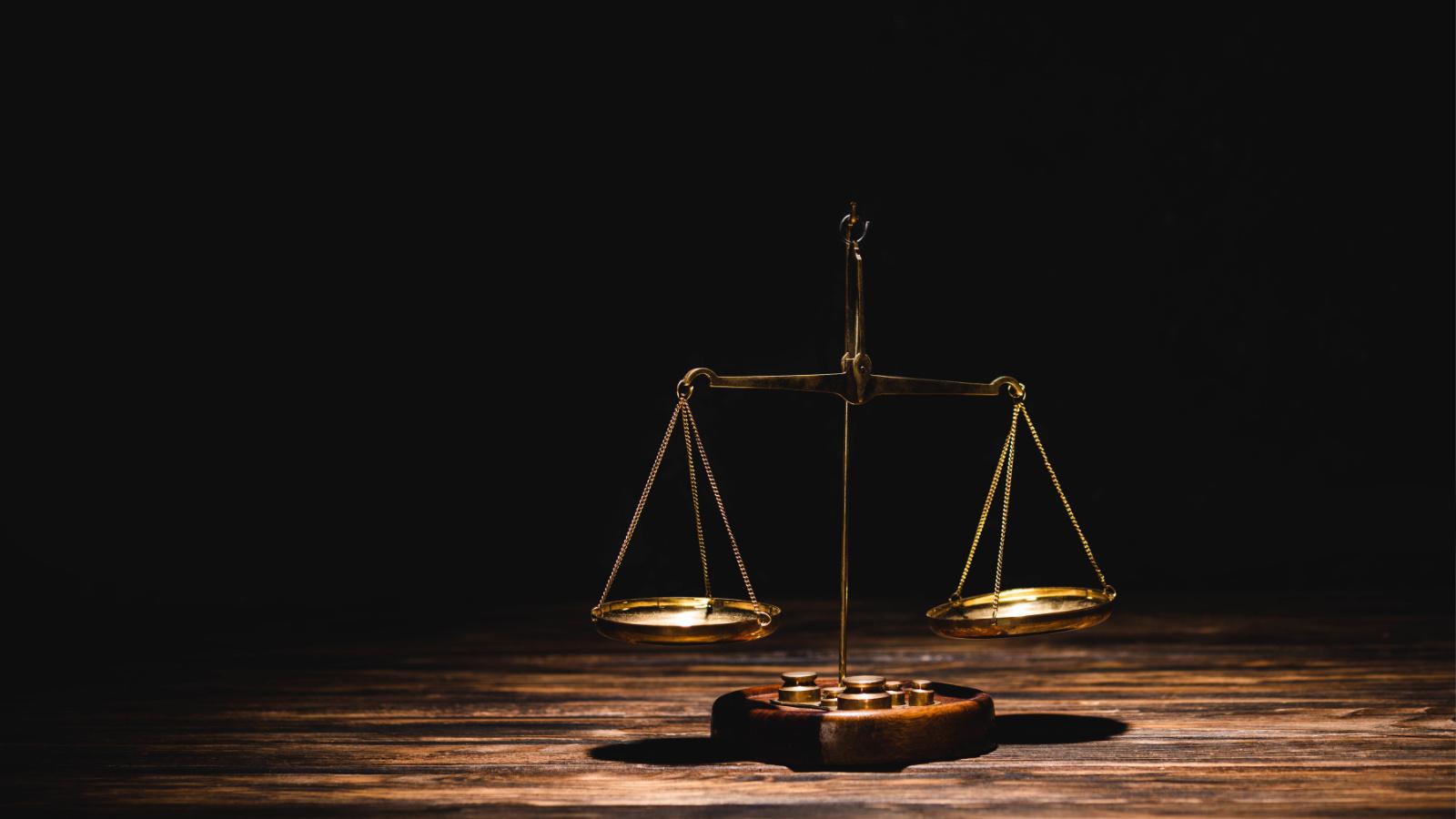 Golden scales representing the balance and evaluation of ROI in experiential marketing campaigns.