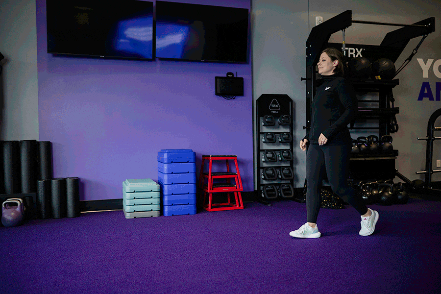 AF Coach Heather demonstrates the Frankenstein walk.