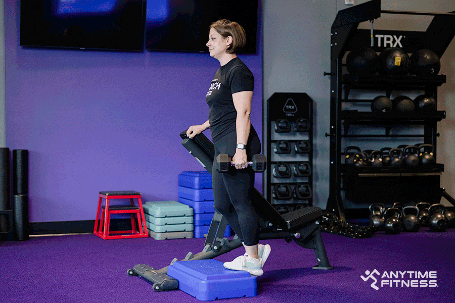 An AF Coach performs a single-leg calf raise.