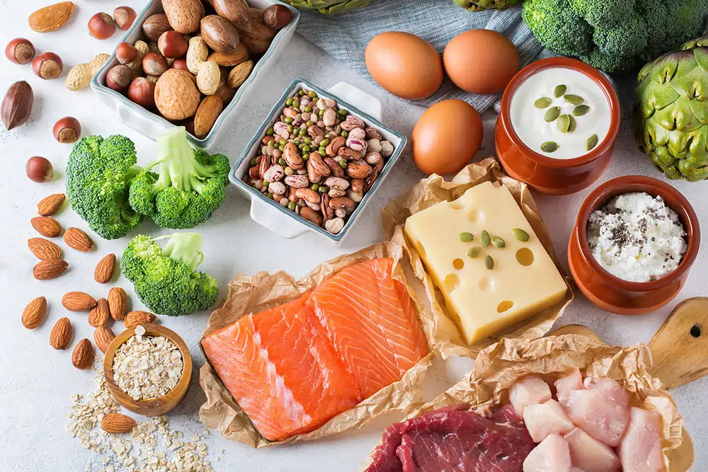 Variety of foods that increase GLP-1 naturally, including salmon, nuts, vegetables, and oats. 