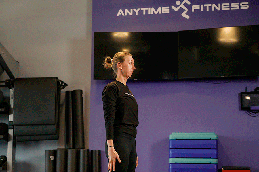Anytime Fitness Coach demonstrating shoulder circles for shoulder mobility.