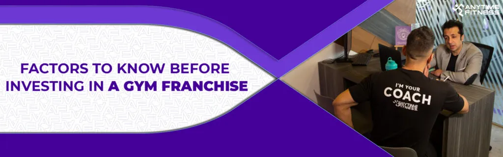 A banner titled "Factors to Know Before Investing in a Gym Franchise." The right side shows a person wearing an "I'm Your Coach" shirt sitting across a desk from a consultant in a professional office setting.