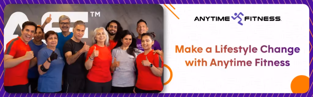 Anytime Fitness banner with the heading "Make a Lifestyle Change with Anytime Fitness." The left side features a group photo of diverse, smiling gym members of various ages giving thumbs-up in front of the "AF" logo, showcasing a supportive community environment.