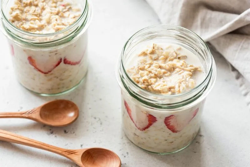 High-fiber, high-protein vanilla overnight oats in glass jars.