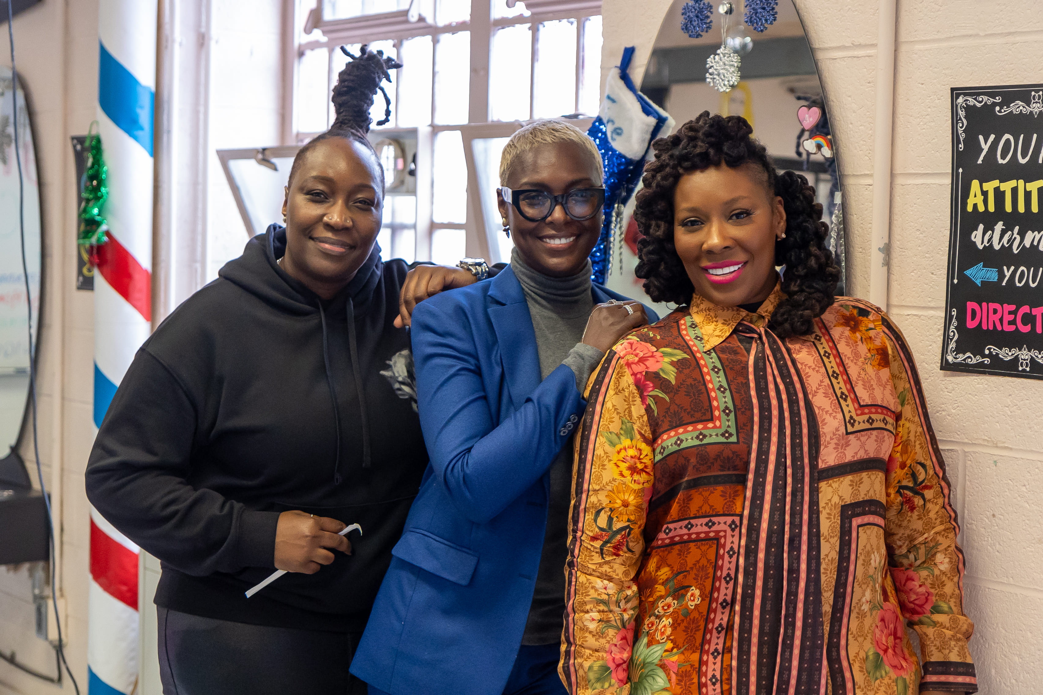 Dr. Topeka K. Sam with two women at Taconic Correctional Facility.