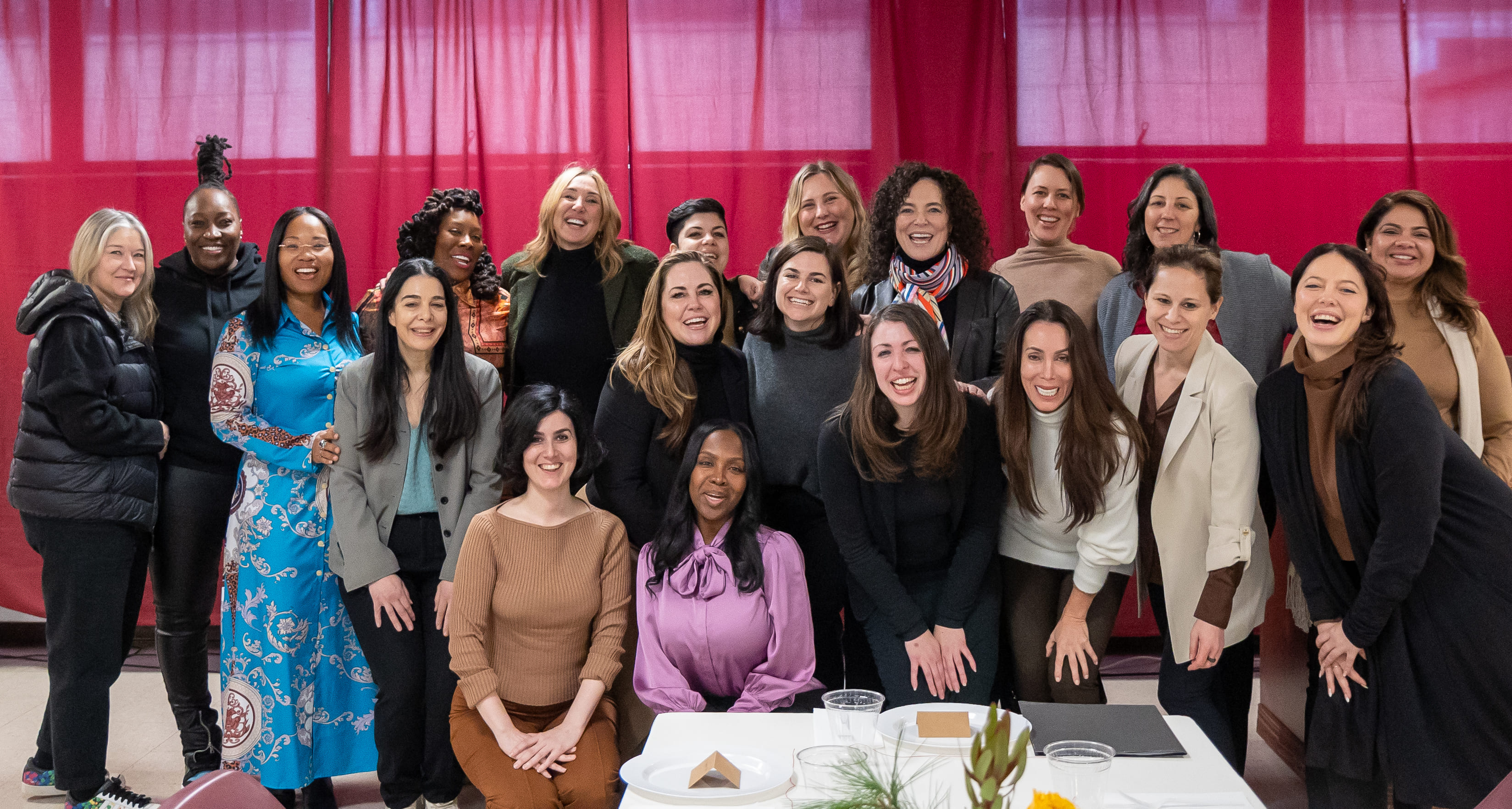 Volunteers and guests gathered for a group photo at the Women Over Dinner event.