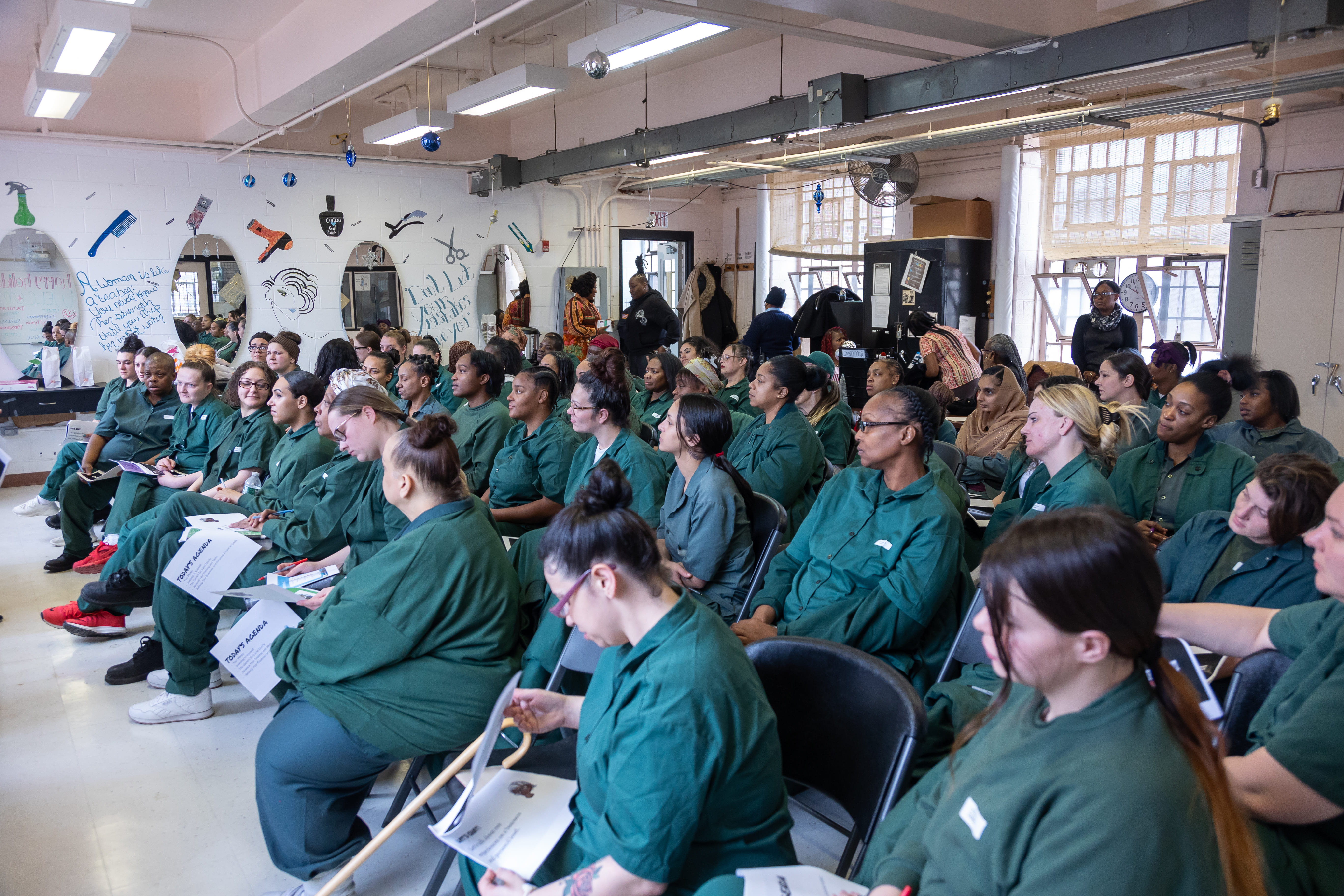 Women seated with programs in hand during the Taconic event.