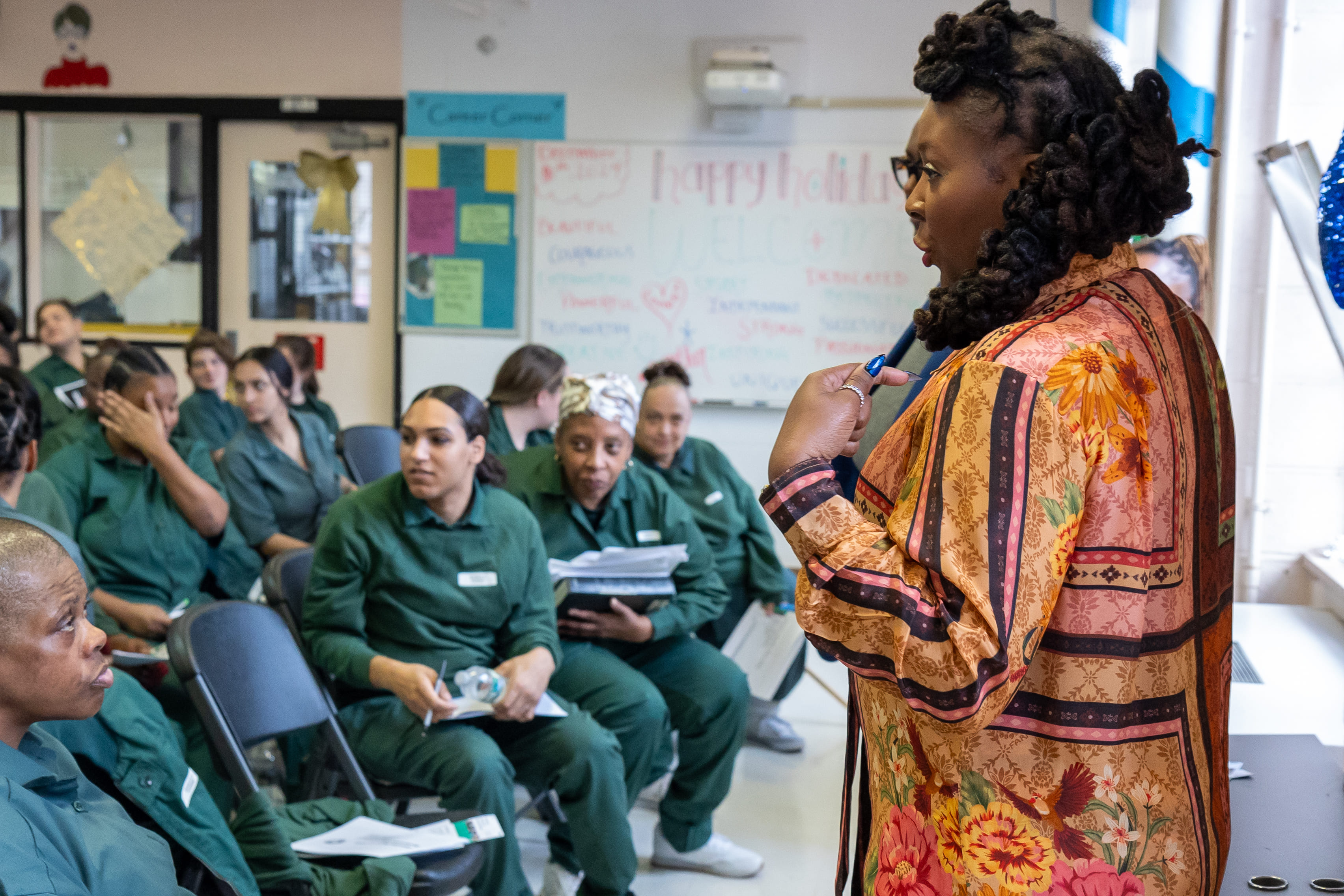Dr. Topeka K. Sam speaking to a seated group in a classroom at Taconic.