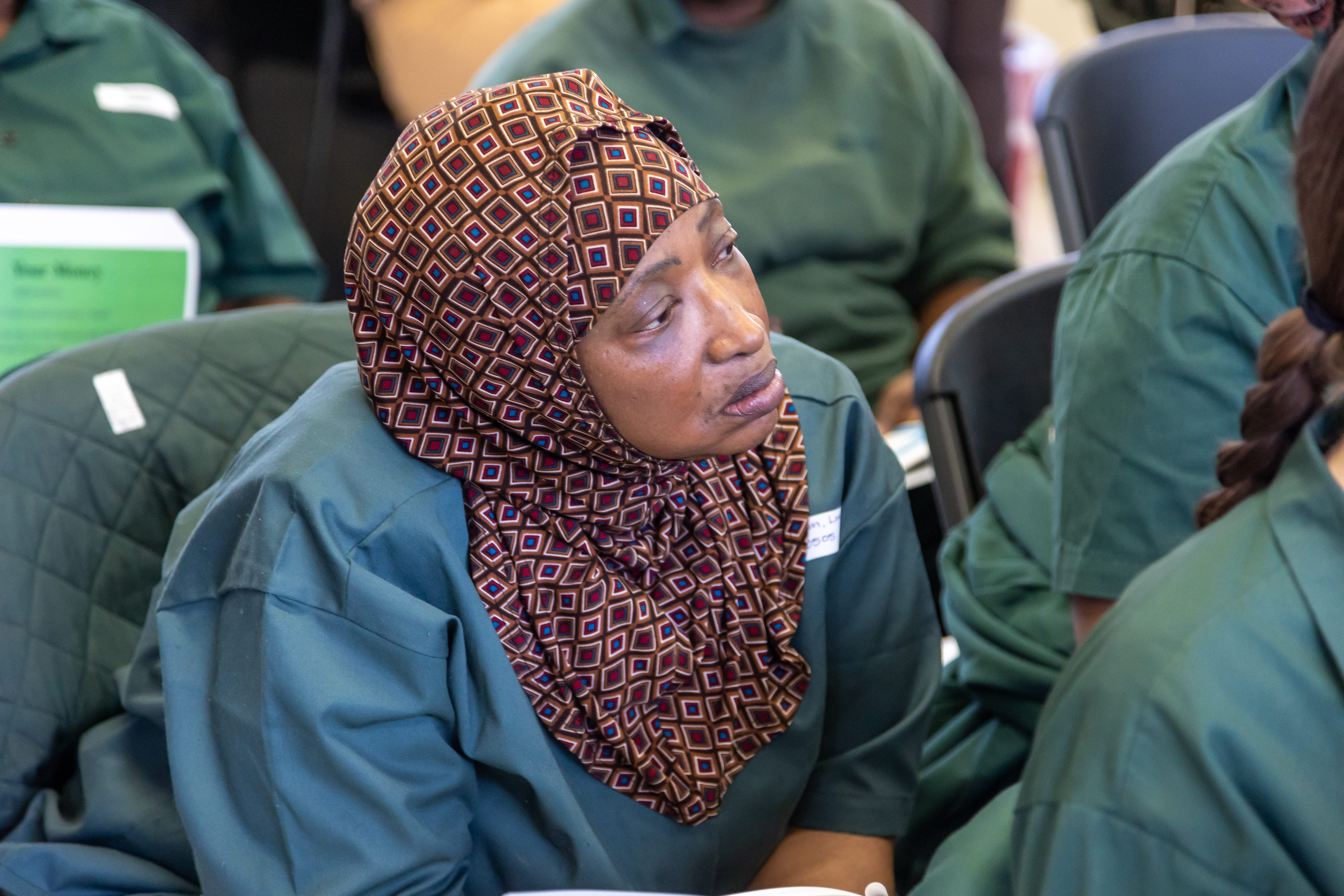 A woman listening intently during the program at Taconic.