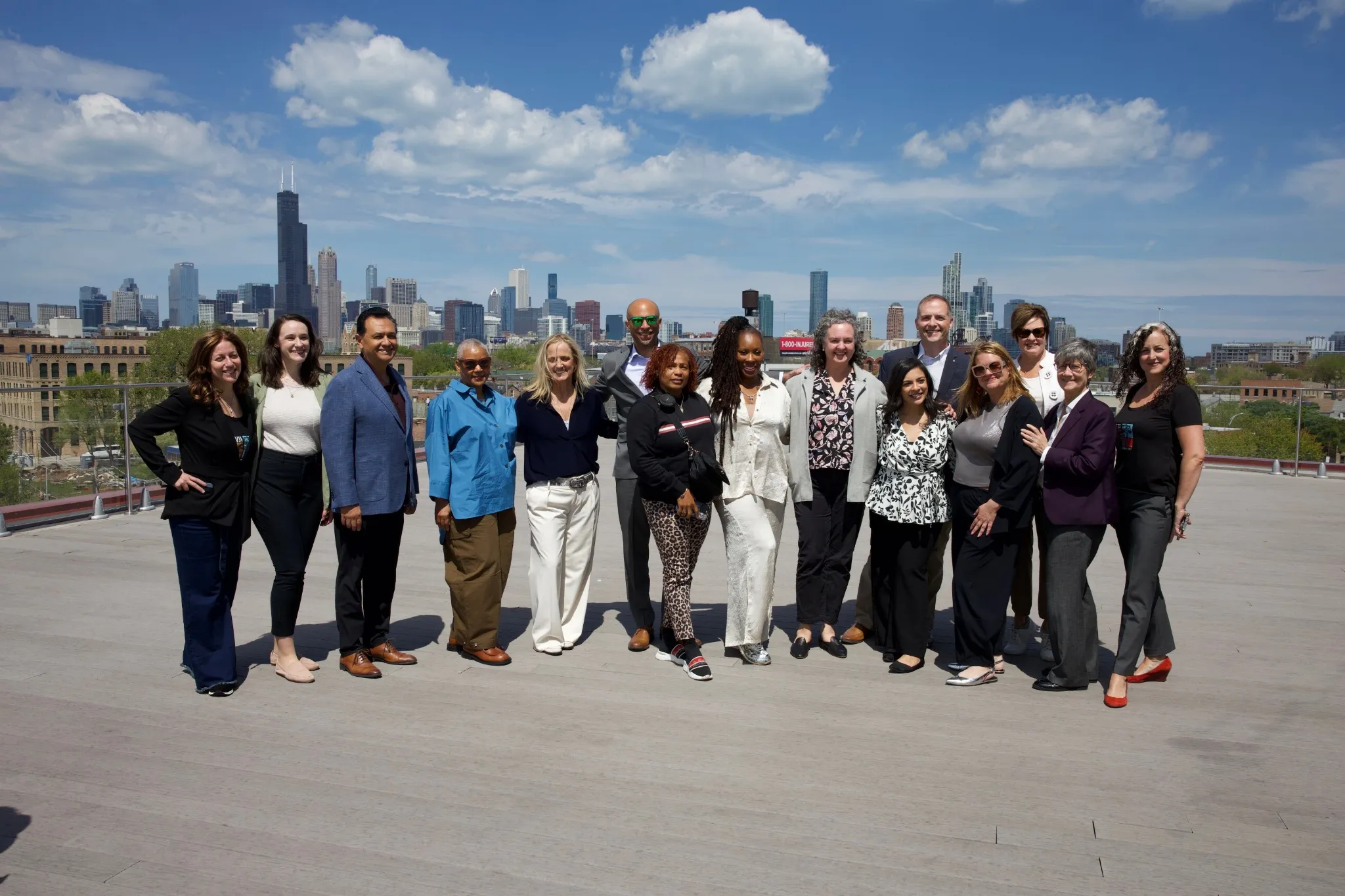 Commission members lined up for a rooftop group photo in Chicago.