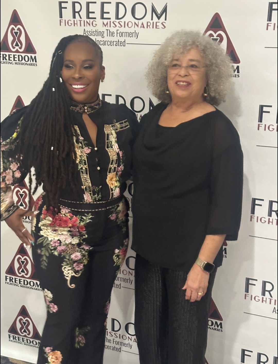 Dr. Topeka K. Sam standing with Dr. Angela Y. Davis at the gala step and repeat.