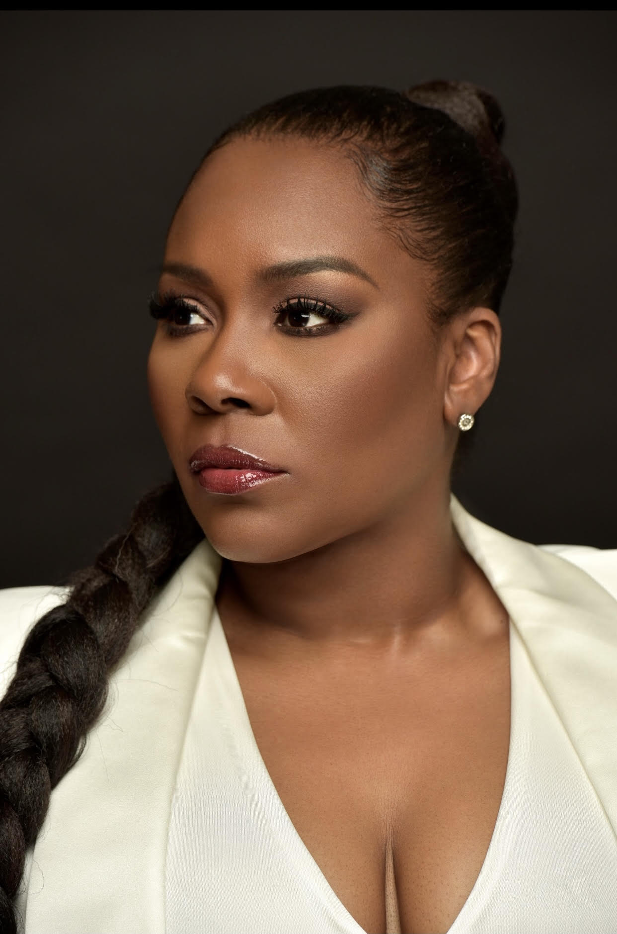 Headshot of Dr. Topeka K. Sam in a white blazer.