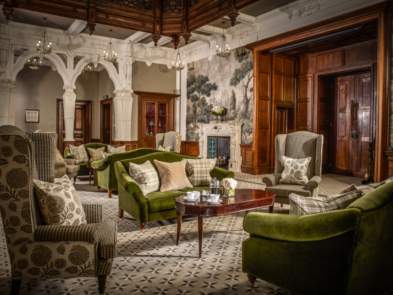 A living room filled with furniture and a fire place.