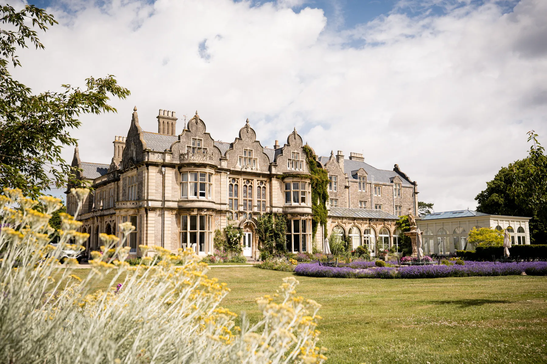 A large building with a garden in front of it.