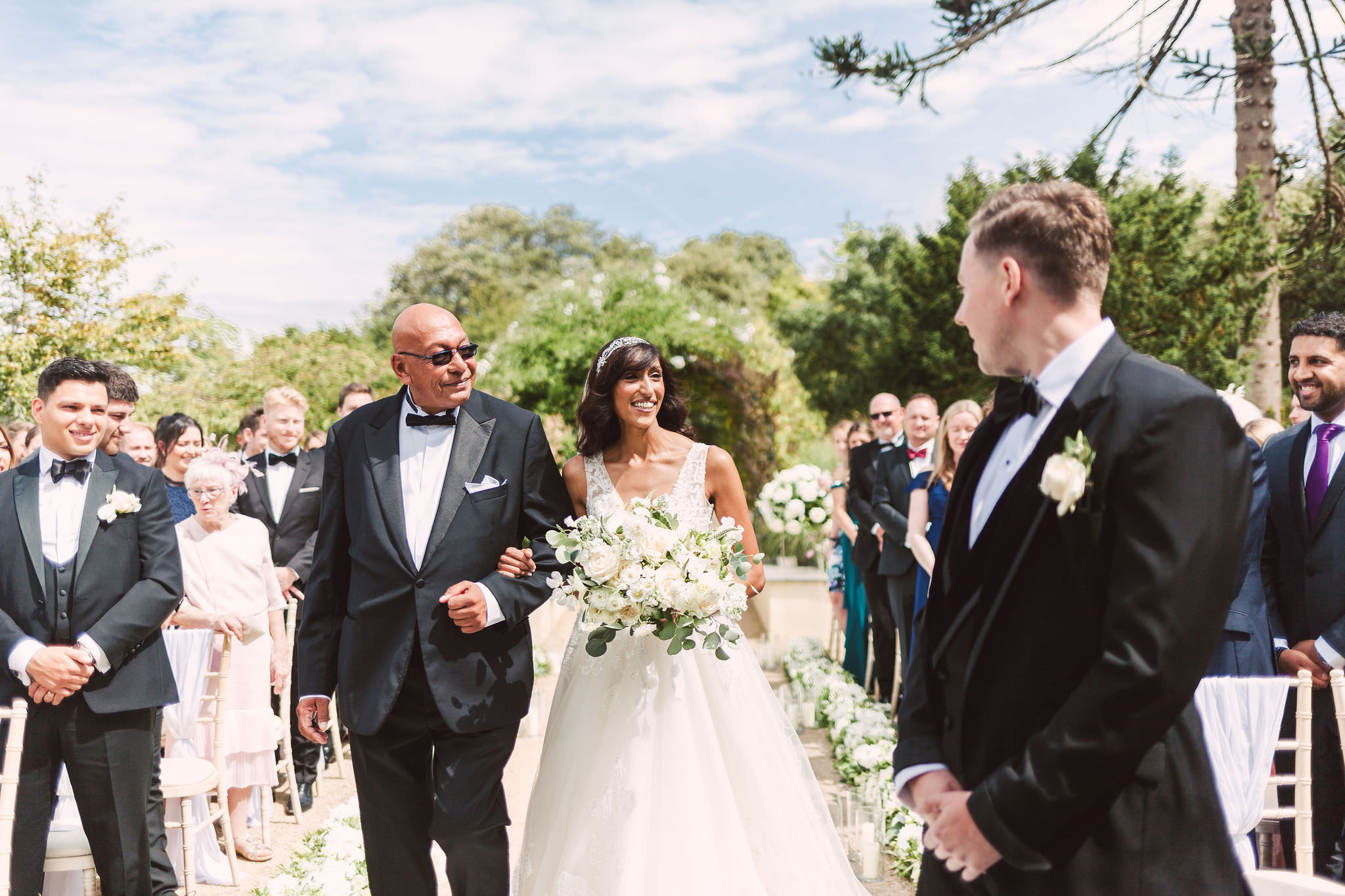 a man and woman walking down a aisle