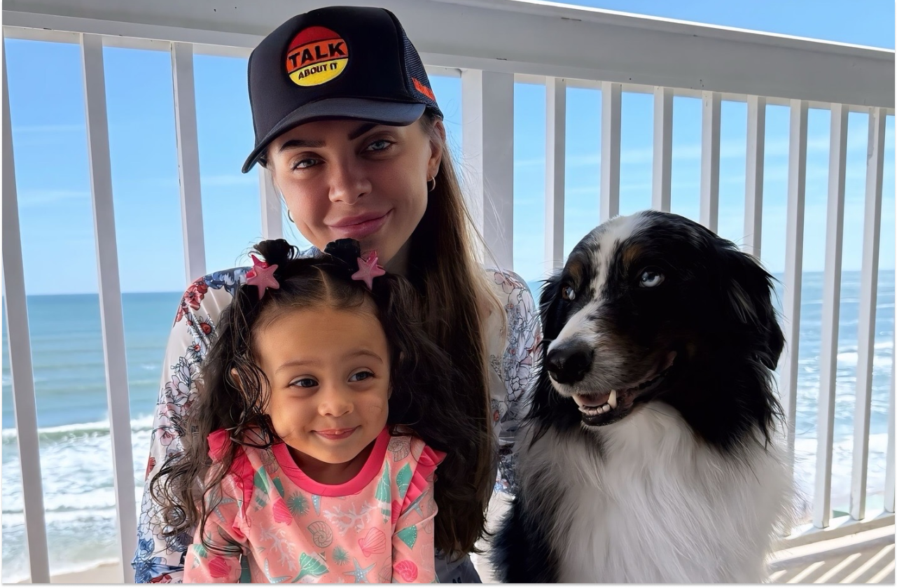 Jaime (EmbracingEcho) with her family in front of the sea