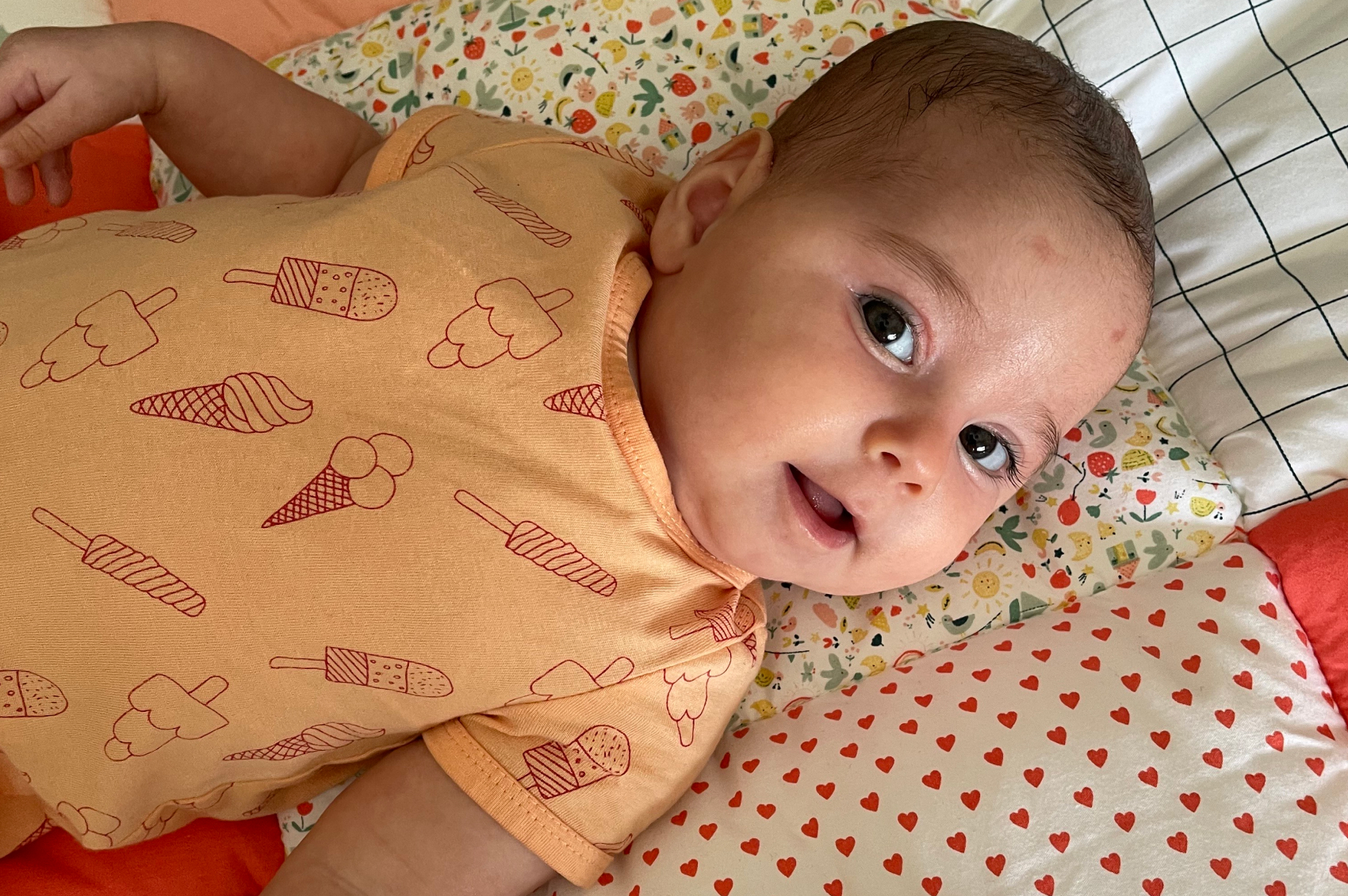 Baby Astrid smiling at the camera