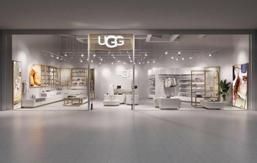 Entrance of the UGG store in Kyiv Ukraine . Made by interior designer . Big glasses and big logo on the top of the entrance .