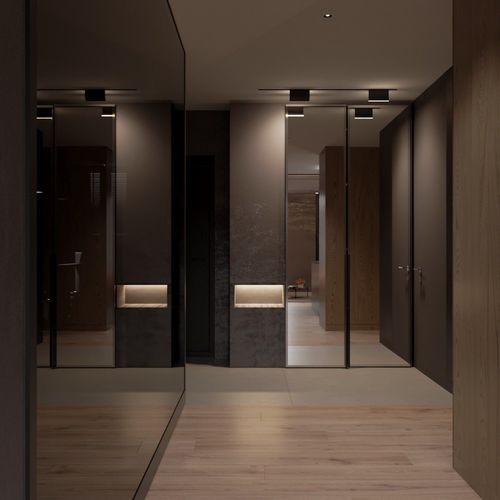 Contemporary lounge area with plush seating, a media console, and an open kitchen layout.