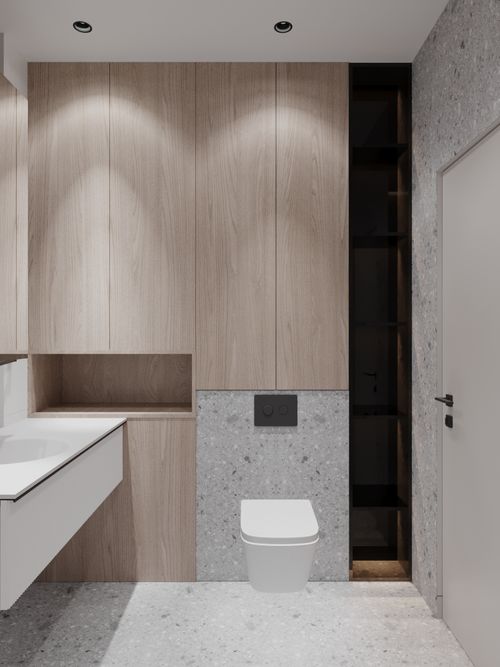 another angle of the toilet room with shower and other furnitures .