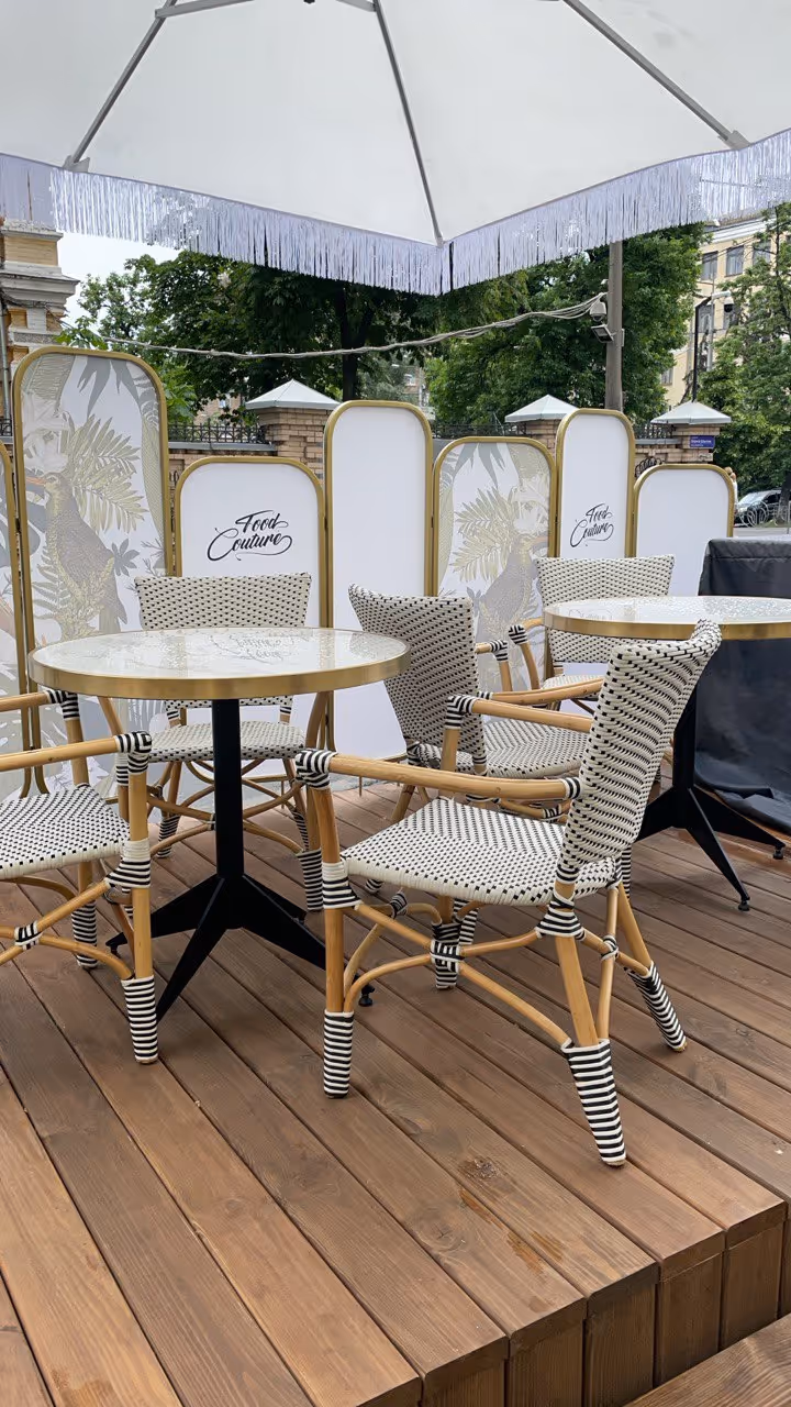 photo of the tables and chairs of the restaurant food couture . 