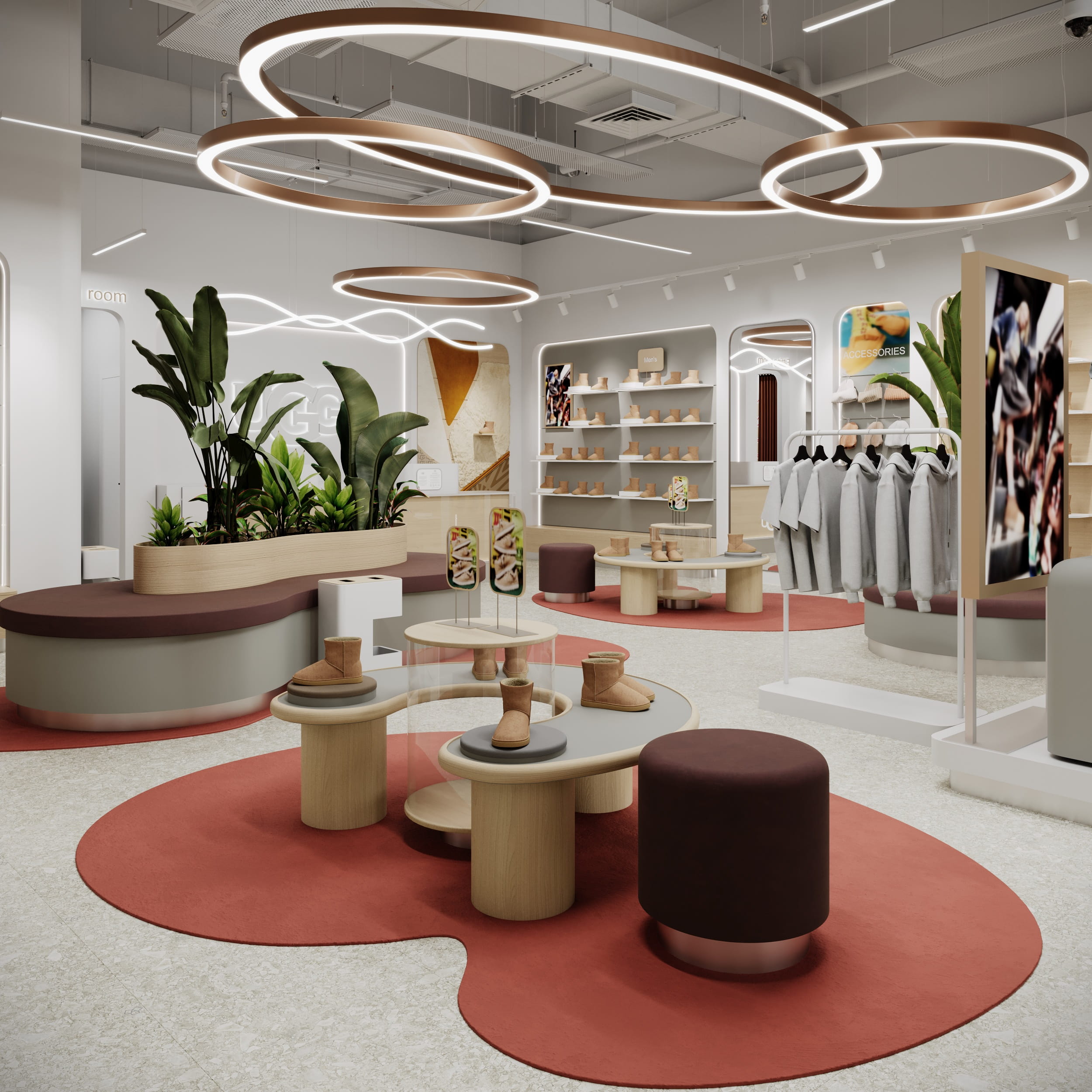 Торговий зал магазину UGG з чітким зонуванням, круглими острівними столами та м’яким освітленням.