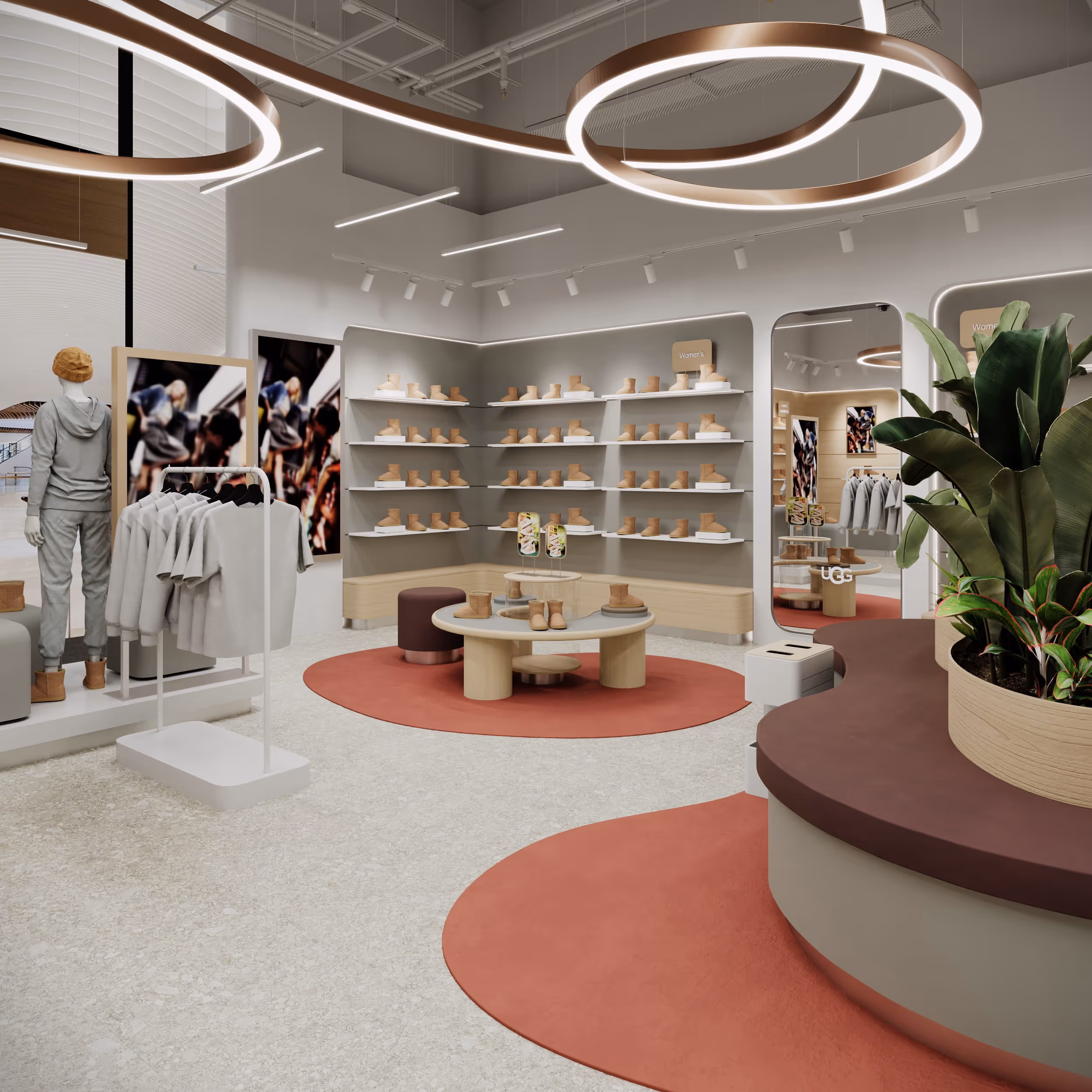 Зона жіночої та чоловічої колекції UGG з настінними полицями та дзеркалами.